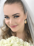 Bride Wearing Yellow Iridescent Crystal Jewelry Earrings - Product model Makeup by Helene Kristoffersen
