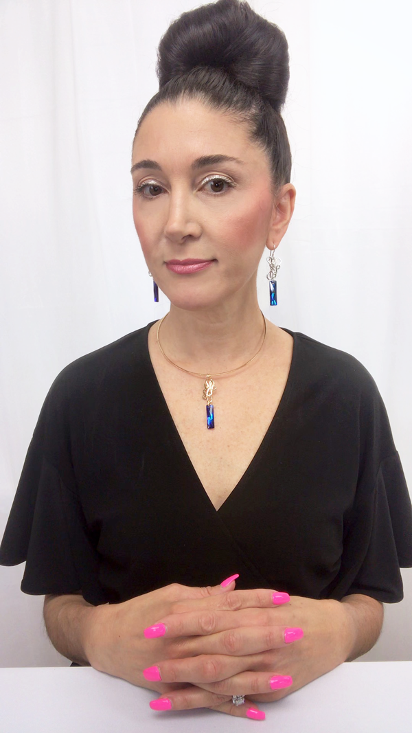 Jewelry Designer, Lisa Ramos wearing  One of a kind sculpted  earrings - Swarovski 