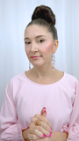 Designer, Lisa Ramos showcasing a the these pink chandelier earrings.  